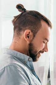 An arrangement of hair high on the head and usually in a knot the dome light lit the inside of the car. The Top Knot Guide What Is It And How Can You Wear It