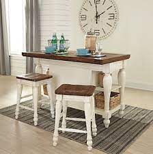 Sweeping slatted shelf houses everything from pots and pans to cookie sheets. Marsilona Kitchen Island Ashley Furniture Homestore