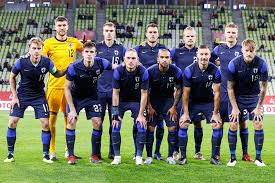 Denmark's distraught players continue to form a wide circular shield. Football Friendly Internationals Team Photos Finland National Football Team Poland Vs Finland