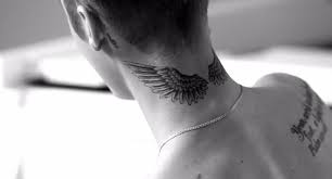 Justin Bieber Explains What His Tattoos Mean Self Wing Neck Tattoo Neck Tattoo Wings Tattoo Neck