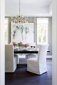 Enjoy your meals in style with modern dining chairs and kitchen chairs. White Slipper Chairs With Black Trestle Dining Table Transitional Dining Room