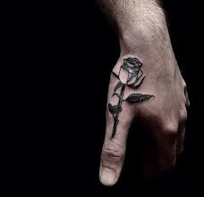 Amazingly Placed Rose On Thumb Pairodicetattooscom Rose Tattoos For Men Hand Tattoos For Guys Tattoos For Guys