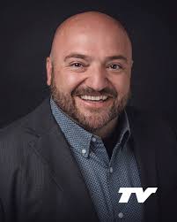 🎓 Alumni Spotlight: Dr. Benjamin Merrill Dr. Benjamin Merrill, a Baker  High School graduate, began his college journey at Treasure Valley  Community College after facing financial barriers and uncertainty about  higher education.