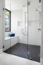 Stunning Master Walk In Bathroom Boasts A Large Walk In Shower With White Wall Tiles And Black Grid Floor Shower Wall Tile Shower Floor Tile White Tile Shower