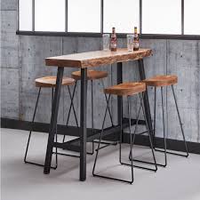 The tree stump at the base holds the water and the pump to circulate the water continuously. Edge Tree Trunk Bar Table Curiosa Living Lifestyle Furnishings