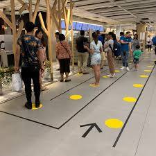 Bright Tape Promoting Social Distancing Transforms Public Architecture In Singapore Colossal In 2020 Wayfinding Floor Graphics Signage Design