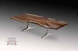 Cisco's mountain modern coffee table made with four squared off pine rounds on engineered metal base with black hardwood dividers. Rare Wood Slab Coffee Tables Jeffrey Greene Design Studio