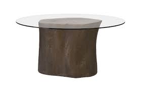 An elegant 2 tiered coffee table with a glass top to show off the decor underneath on the mirrored base. Log Bronze Dining Table
