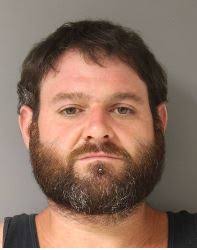 This Mastic business owner has been arrested for scamming 10 customers out  of a combined $20,000 and police are asking other members of the public to  come forward if they also have