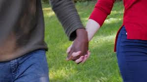 5 out of 5 stars. Close Up On Interracial Love Romance Concept Black Man Hand Holding White Woman Hand By Dream One