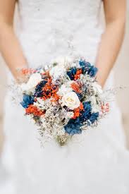 Our floral designers arrange each bouquet specifically to maintain quality and consistency for its overnight trip. Edinburgh Wedding Photographer Laura David Orange Wedding Bouquet Orange Wedding Flowers Wedding Flowers