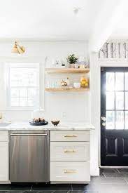 Check spelling or type a new query. White And Gold Kitchen Features White Shaker Cabinets Adorned With Brass Pulls Paired With Calcutta Marb Contemporary Kitchen Kitchen Design Kitchen Renovation