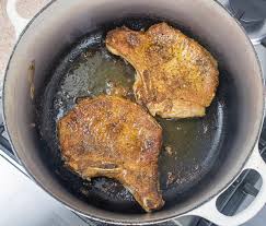 Oven baked pork chops seasoned with a quick spice rub and baked to perfection. Cajun Smothered Pork Chops First You Have A Beer