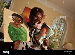 Decatur, Georgia. 20th Mar, 2008. Lois Curtis displays self portrait with  one of Elaine Wilson. The two women were at the forefront of a U.S. Supreme  Court case that resulted in the