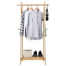 Angled frame keeps clothes from hitting the wall and provides a sturdy base so rack will not fall over. China Bedroom Bamboo Frame Garment Rack Cloth Hanger Shelf Wooden Clothing Hanging Clothes Rack With Laundry Basket China Clothes Rack Price