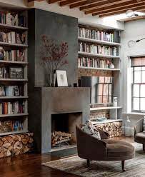 carrie delany interiors on instagram wood beams a wall of books and a fireplace makes for a space i d never want to leave and then th in 2021 home fireplace design