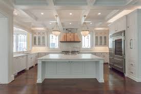 Traditional All White Kitchen With Coffered Ceiling And Copper Range Hood In Custom Home By Bcn Hom Large Kitchen Layouts Large U Shaped Kitchens Home Kitchens