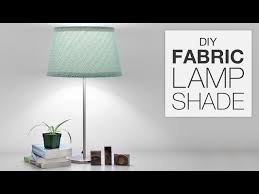 Lamp shades should generally match the shape of the lamp: How To Cover A Lampshade With Fabric Diy Tutorial Youtube