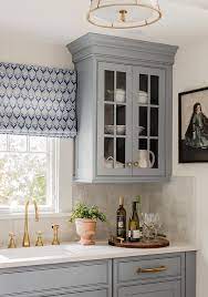 White cabinets can also brighten up a dark room. Gray Blue Kitchen Cabinets With Gray Backsplash Tiles Transitional Kitchen