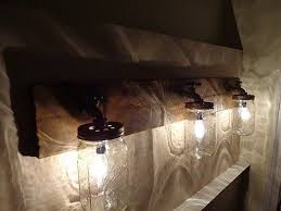 When a dimmer switch is added to the equation, they can create a warm glow for an evening soak. Primitive Mason Jar Rustic Bathroom Vanity Light Fixture Rustic Bathroom Lighting Light Fixtures Bathroom Vanity Rustic Bathroom