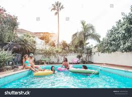 Happy Friends Floating With Air Lilo Mattress At Swimming Pool Party Young People Having Fun On Summer Ho Party Swimming Pool Happy Friends Holiday Vacations