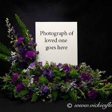 Maybe you would like to learn more about one of these? Photograph Of Our Very Popular Purple Themed Cremation With Photograph Arrangement Flowers Surround Funeral Flowers Funeral Floral Funeral Flower Arrangements