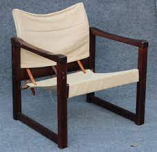 Leather sling chairs have long been popular, with older editions for sale from the 19th century and newer versions made as recently as the 21st century. Lot Art Mid Century Modern Cube Sling Chair Maker Unknown