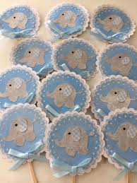 Snug the green tissue paper in between the cupcakes. Elephant Baby Shower Decor Boy Baby Shower Decor Elephant Cupcake Top Elephant Baby Shower Decorations Baby Shower Decorations For Boys Boy Baby Shower Decor
