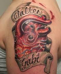 Sugar skull with banner tattoo on biceps. 45 Creative Banner Tattoos Ideas Designs For Men Women Picsmine