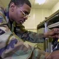 Lieutenant (LT) Andrew Rue discusses paperwork during Exercise SHADOW  HAWK'87, a phase of BRIGHT STAR'87. The US Central Command exercise  represents a Joint Chiefs of STAFF effort to evaluate procedures used to