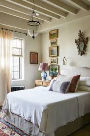 A green floral material wraps the walls like the woods outside and continues onto the bed, a bench, and the curtains. 18 Best Above Bed Decor Ideas How To Decorate Over The Bed