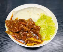 Pilchards in cabbage with pap..