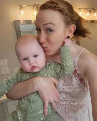 It took me a minute to post this but it's too cute! @cmsebesta looking  beautiful in her emerald green Festive Earrings! Isn't her little guy just  the sweetest thing!? It's the cheeks