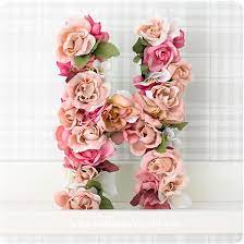 For A Cute Personalized Touch To Your Home This Summer Make This Papier Mache Flower Letters Craft Its Flora Flower Letters Flower Crafts Paper Mache Letters