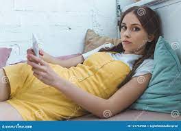 Teen Girl Using Smartphone and Lying Stock Photo - Image of caucasian,  girl: 127766944