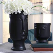 This vase is brought to life when filled with fresh blooms and botanicals dimensions l15 x w12 x h26 cm material dolomite Face Vase Black Face Vase Black Vase Face Vases Ceramics