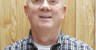 County commissioner suspended from teaching job