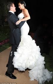 Kim kardashian reveals she hid her wedding ring from kanye west while married to kris humphries in order to spare the rapper's feelings. In Happier Times Kris Humphries And Kim Kardashian Enjoy An Intimate Moment Kim Kardashian Wedding Dress Wedding Dresses Kardashian Wedding