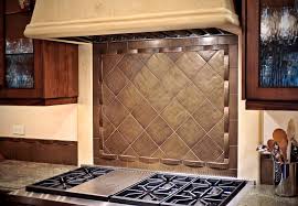 bronze tile backsplash over stove