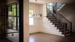 The black metal fabrication is sleek and grounds the white and light finishes found elsewhere in the open living space. Building A Modern Railing In 2016 Southern Staircase Artistic Stairs