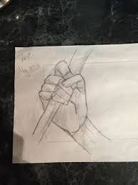 A Hand Holding A Stick