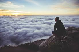 Man Sitting and Watching Clouds from Mountain Top | Free Photo by ...