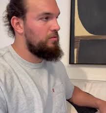 What does Amber's partner do for a living and what is his background?