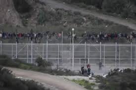 Thousands of moroccans took advantage of relaxed border c… 1 100 Migrants Storm Border Fence Try To Enter Spain S Ceuta Enclave Upi Com