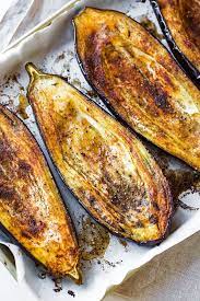 Stuffed Eggplant With Garlic Tahini Sauce The Cozy Apron Recipe Recipes Cooking Recipes Eggplant Recipes