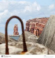 Find hotels near lange anna, germany online. Lange Anna View Through The Metal Eyelet Of A Tetrapod To The Red Rock Of Helgoland A Royalty Free Stock Photo From Photocase