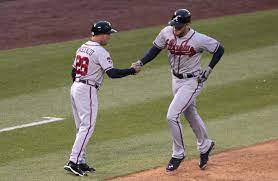 Atlanta Braves Third Baseman Coach Doug Dascenzo 28 Greets Freddie Freeman As He Rounds Third Base On His Solo Atlanta Braves Baseball Atlanta Braves Braves