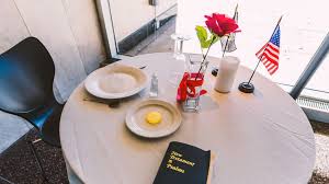 This table, set for one, is small, symbolizing the frailty of one prisoner, alone against his or her suppressors. Missing Man Table War Memorial Center