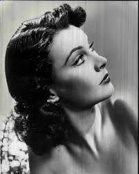 I was born in India, brought up in-- let me see-- Italy, France, Germany  and Ireland. My mother is Irish, you see." We saw. In her extraordinary  grey-green Celtic eyes, which flickered