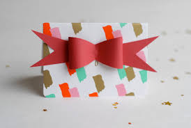 Punch out an ornament shape and stamp a phrase on it. How To Make Paper Bows Free Template Tutorial Craftsy